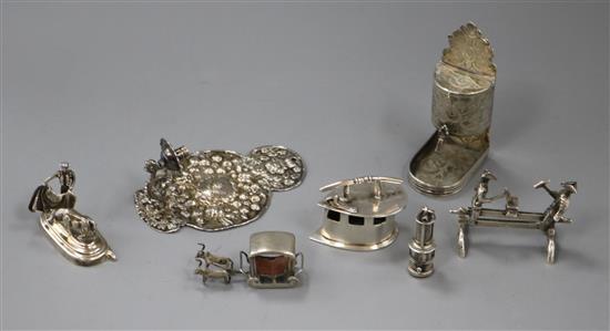 A group of miniature silver and white metal novelties,